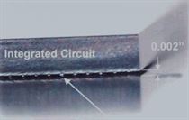 This BGA chip on a printed circuit board has a 2 mil stand-off from the substrate. Modern solvents can clean beneath this component but aqueous cleaning systems will struggle to get into such tight spaces