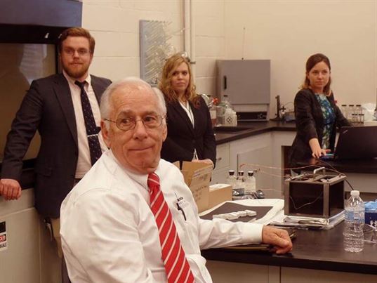 John Hoffman, MicroCare sales, listens to comments during the Critical Cleaning Lab presentation while Adam, Joanna and Venesia listen