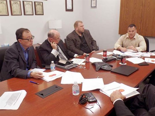 Mike Torillo (right) introduced the sales team to product commercialization plans and schedules. Left to right: Dixon Tan, Dave Ferguson, Scott Wells