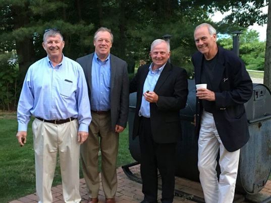 Steve LeFebvre, Jay Tourigny, Carroll Smiley and Russell Claybrook enjoying the weather and cigars