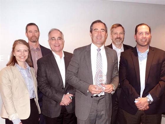 The HISCO team accepts the Distributor of the Year award from Tom Tattersall, MicroCare chief executive