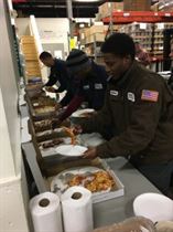 Solomon, Jamar and Mike choose from 6 different pies from Elm Street Pizza.