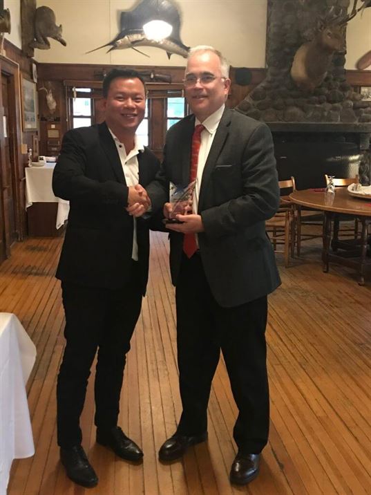 Jerald Chan, Asia Regional Manager accepts the “Star Sales Performer” Award from MicroCare COO, Tom Tattersall