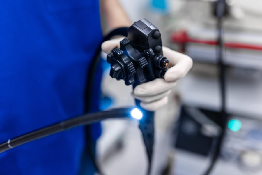 Proctologist Holding Endoscope During Colonoscopy
