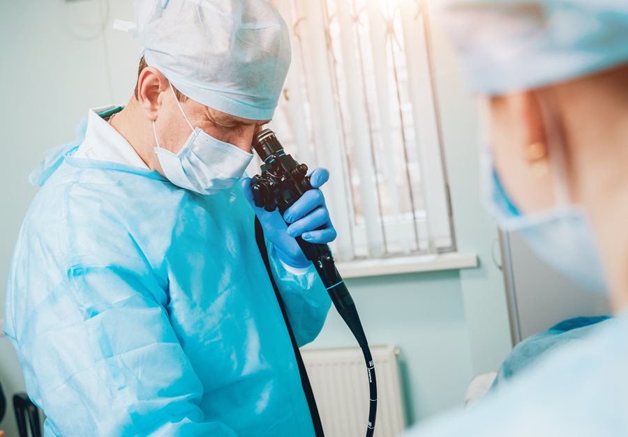 Doctor Using Endoscope in Procedure